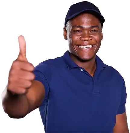 Smiling male plumber wearing a navy cap giving a thumbs-up – Bomba Plumbers technician ready for plumbing service.