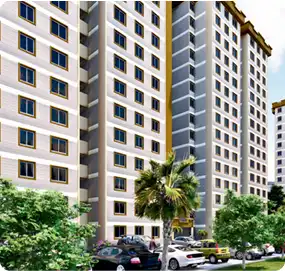 Tall multi-story residential towers with palm trees and cars parked outside – high-rise plumbing project by Bomba Plumbers.