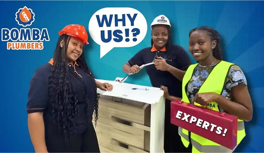Promotional graphic featuring three female Bomba Plumbers staff in uniform with a speech bubble reading “Why us?” and a red “Experts!” sign.
